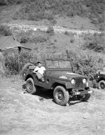 Kim in new Jeep,22,"Korea, area of 38th parallel",Kim,1954,Peter Anthony,"Kim in new Jeep;Korea, area of 38th parallel;Kim; 05/1905; Photograph by Peter Anthony"