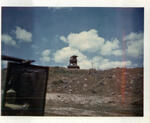 View of the guard tower from the highway near Bao Loc, RVN. Late 1968. Photographed by John E. Boss Jr.