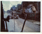Passing a road grader enroute from Bao Loc to Cam Ranh Bay, RVN. 1969. Photographed by John E. Boss Jr.