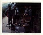John E. Boss Jr. (in cupola) with ARVN. Caption: �Checking out an ARVN armored car.� Dalat, RVN. 1969.