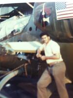 Frederick L. Brown leaning on a chopper on flight deck May, 1973 -  December, 1973