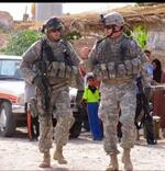 Kevin Brown (right), Patrolling outside a house believed to be a safe house for suicide bombers; Kirkuk, iraq; 2007