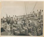 George Butenkoff (3rd from left with arrow pointing at him) with Merchant Marines during a grain run to India during the famine of 1951 Navlaki, India (just north of Bombay/Mumbai 1951