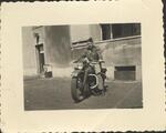 Robert Campbell on a captured German motorcycle; 1945