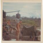 Raisin in a home-made shower; Loc Ninh; 10/1968