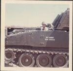 RPG wound on tank. Dave sticking his head out.; Rita; 10/1968