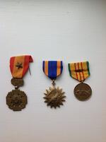 L to R:  South Vietnam Gallantry Cross with bronze star, Air Medal, Republic of South Vietnam Service Medal with two stars