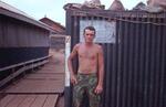 Alan Champagne outside storage box; QuangTri, U.N.; June 1968; Photographed by Ted Cantrell