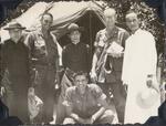 Visiting the priest; Vietnam; Vietnamese Priest,  Army Chaplain, Vietnamese Priest, Army Chaplain, Vietnamese Priest, Major Lopez in Front;  1966-1967;  Photograph by unknown