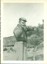 Sgt. Douglas Clement aiming his rifle. Korea, Spring 1952.