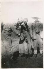Timothy L. Curran. Caption: �treating an Arab.� La Sebala, Tunisia, 07/1943.