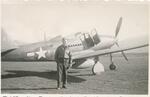 Timothy L. Curran posing near Bell P-39 �Airacobra.� Tunis, Tunisia, 07/1943.