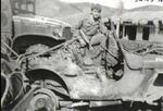 Joe Hernandez on a truck destroyed by the Chinese � Korea - 1950-1951