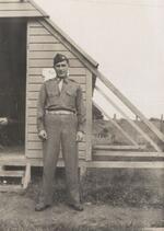 Lt. Kutchman in front of living quarters, New Zealand, April 1944