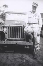2nd Lt. John J. Higgins Sitting on a WWII jeep His wife�s name, Amy, is on the base of the windshield New Guinea, 1944