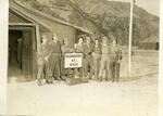 Korea; In 1953; (5th from left with camera/glasses) Melvin Horwitz; Melvin Horwitz and others posing for a photo in front of 47th M.A.S.H. Unit H.Q.