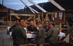 Korea; In 1953; (Center with Glasses) Melvin Horwitz; Melvin Horwitz along with others from M.A.S.H. unit eating a meal