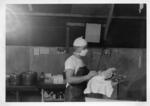 Korea; In 1953; Close in shot of M.A.S.H. employee holding surgical equipment