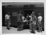 Korea; In 1953; A Wounded soldier pictured being loaded onto a train for transportation