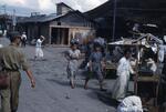 Japan; In 1954; Photograph taken in Japan and pictures locals, stands, and buildings