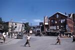 Japan; In 1954; Photograph of Japan street, locals, and damaged brick building