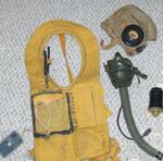 Walter Hushak�s flight equipment L to R: Reflector, Life Vest, Air Mask, Flight Cap, Light Beacon