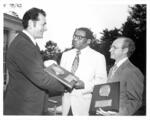 Nicholas Franco hands Dawson E. Shaw and Edward P. Diemente Distinguished Alumni Awards