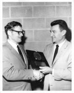 Frank Lattanzio receives Alumnus of the Year plaque from Frank T. Cleland